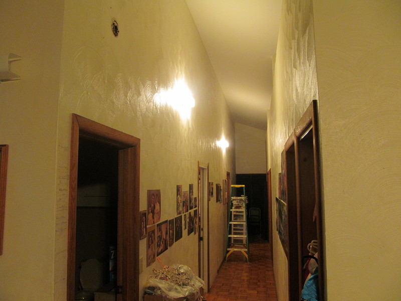 Looking down the hallway, you can see two new lights. Also a ladder that has not been put away yet.