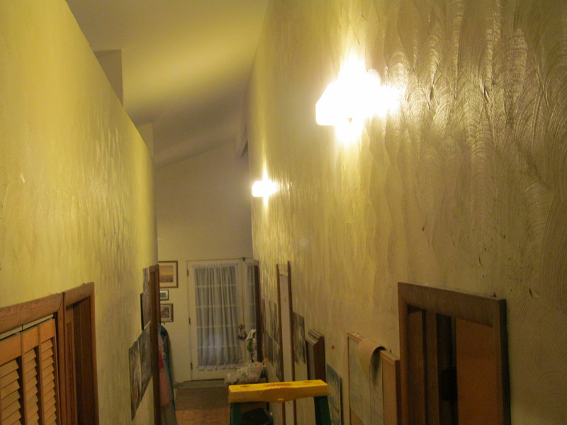 Here is a few from the bedroom end of the hall toward the front door, with both lights on.
